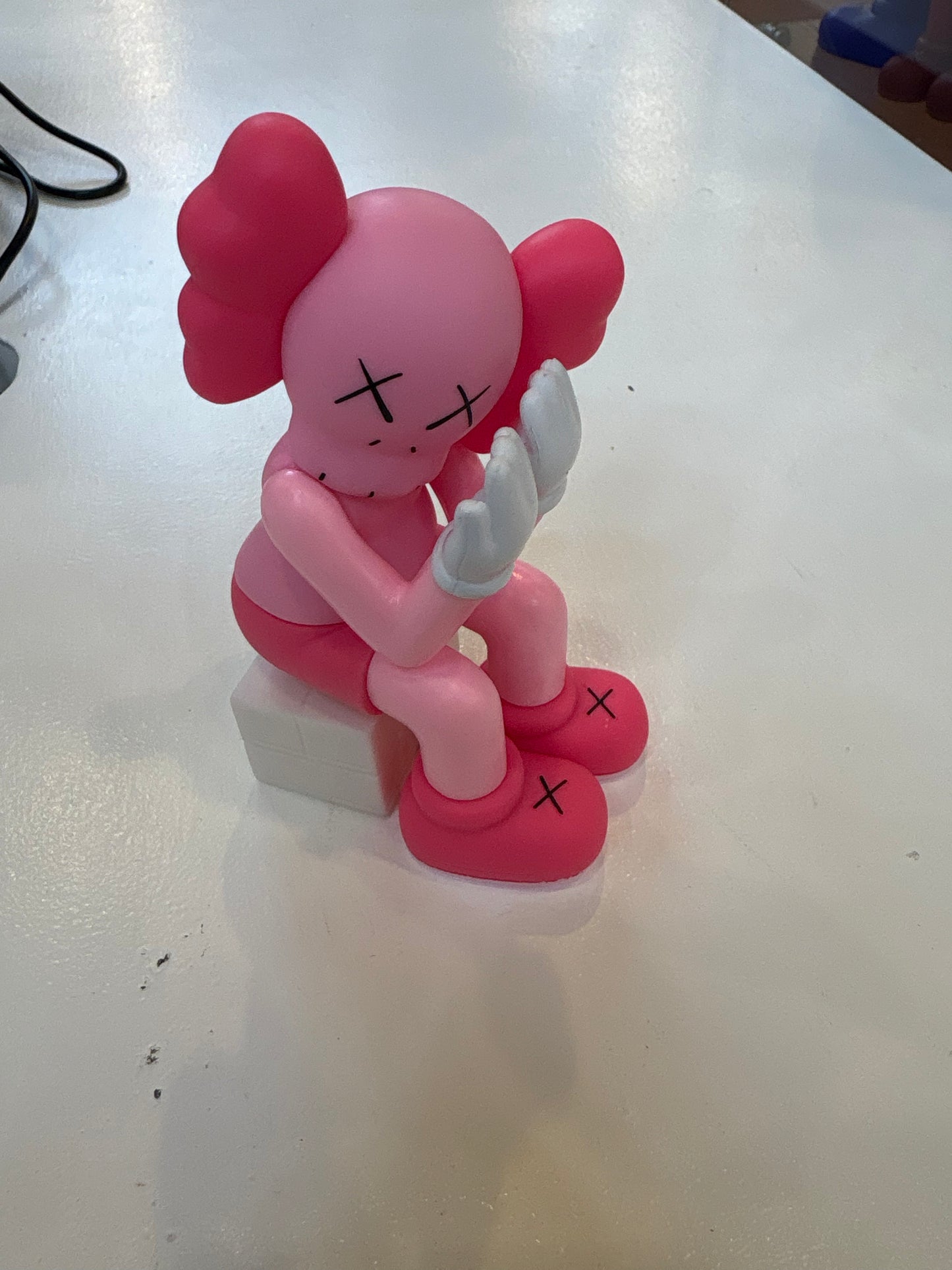 Kaws Pink Sitting Figure